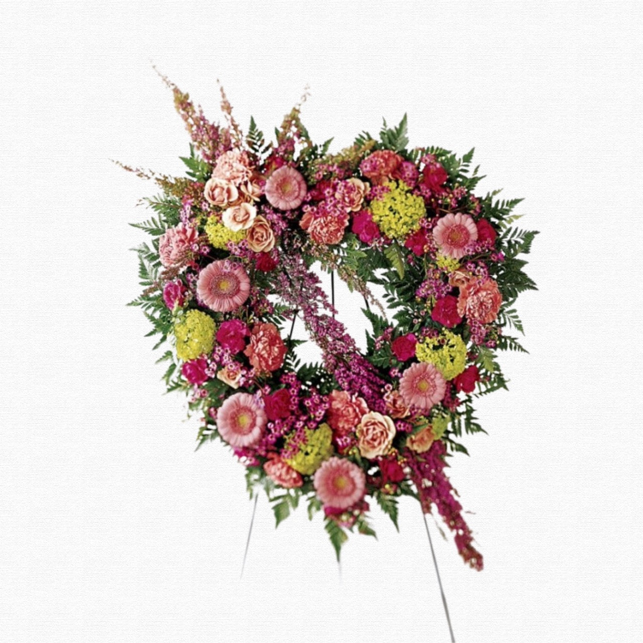 Pink heart-shaped funeral tribute arrangement by Historic Dade City Florist