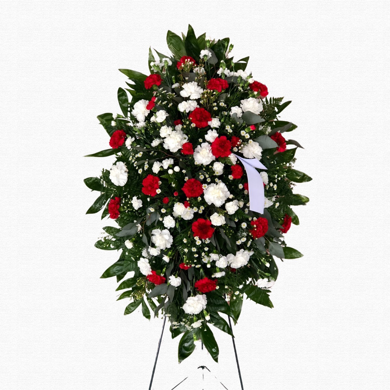 Pastel pink and lavender funeral spray by Historic Dade City Florist