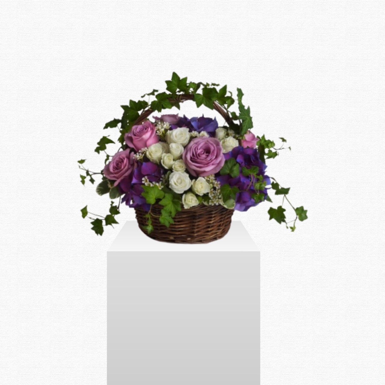 Purple and white mixed flower arrangement by Historic Dade City Florist