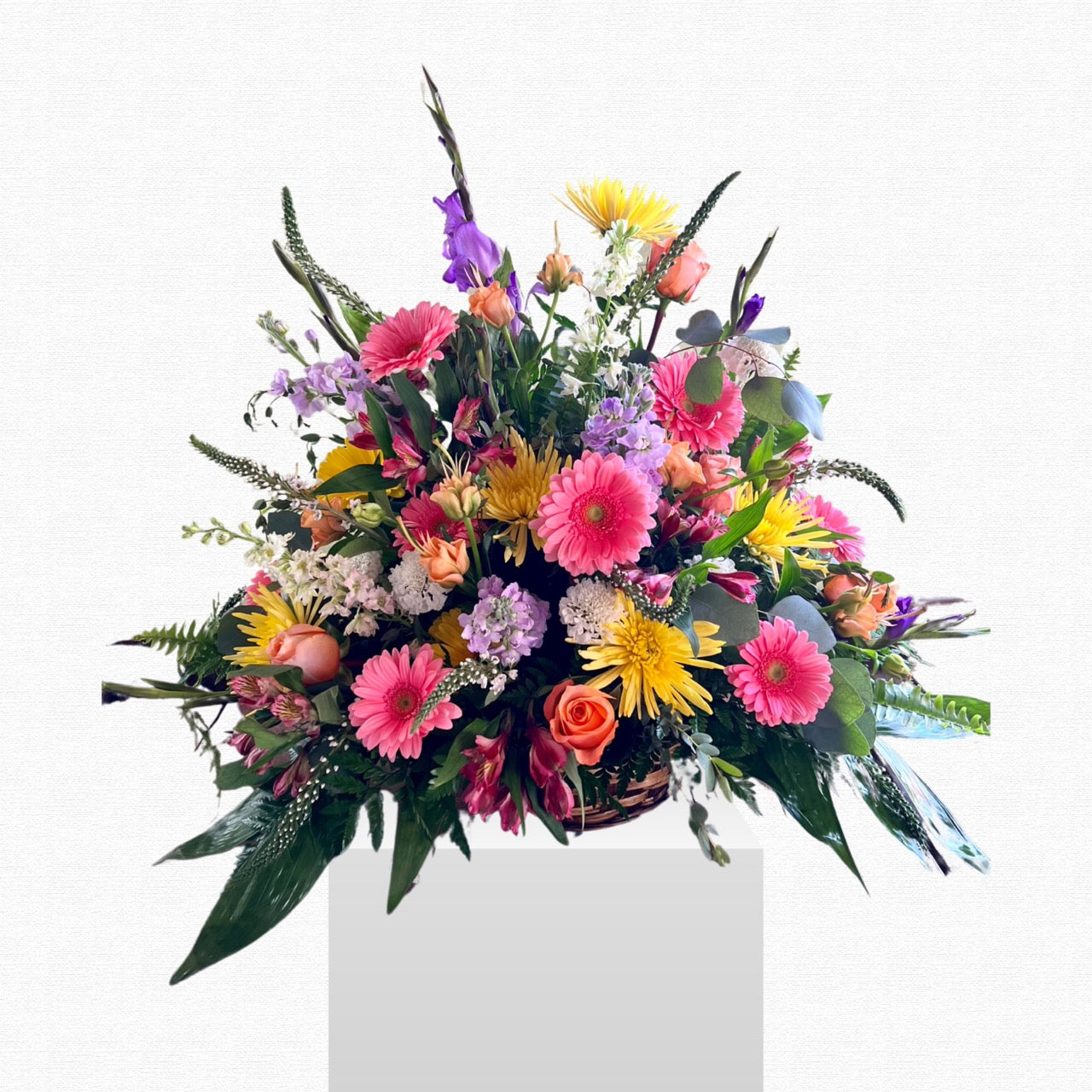 Multicolor pastel floral sympathy basket by Historic Dade City Florist