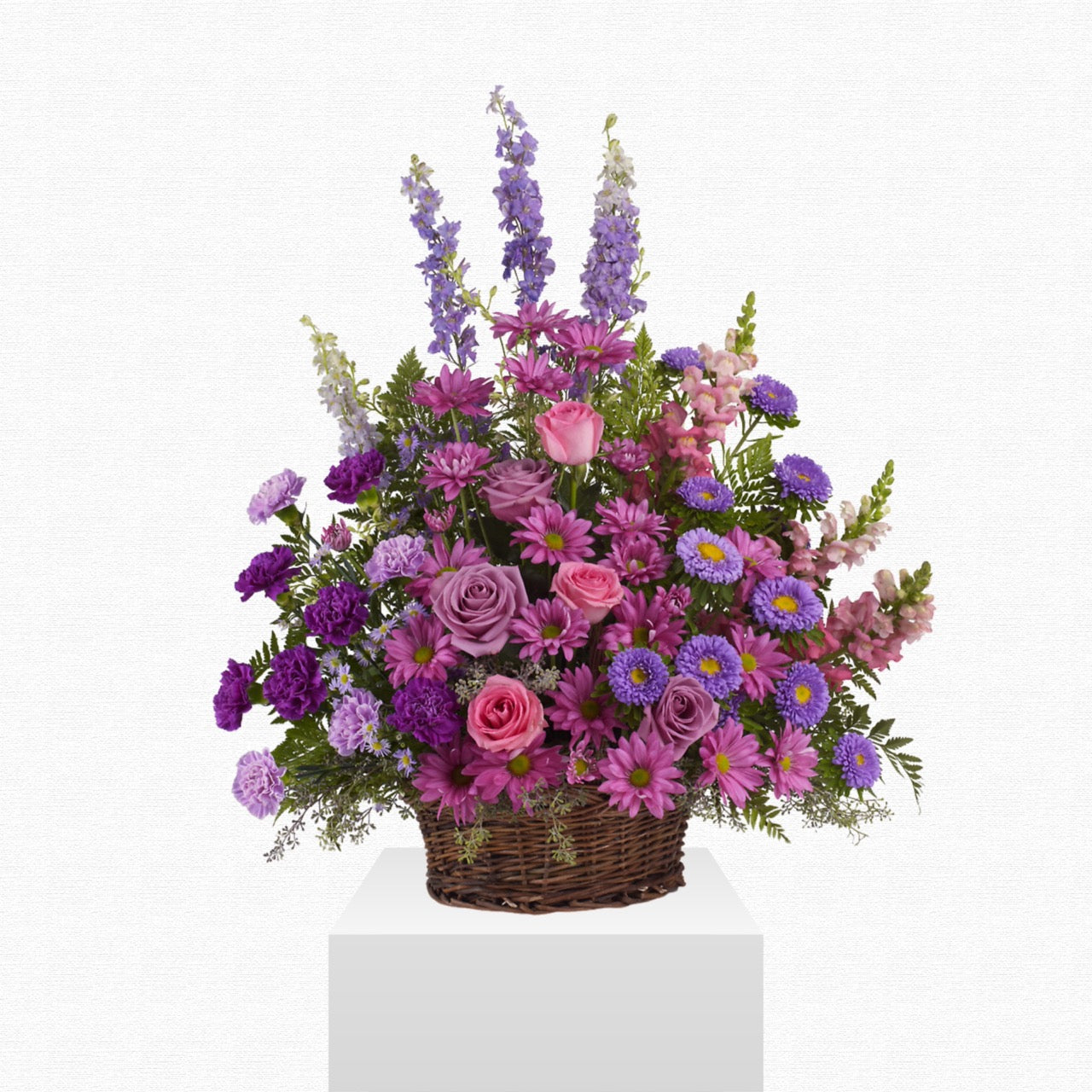 Pink and purple funeral sympathy basket by Historic Dade City Florist