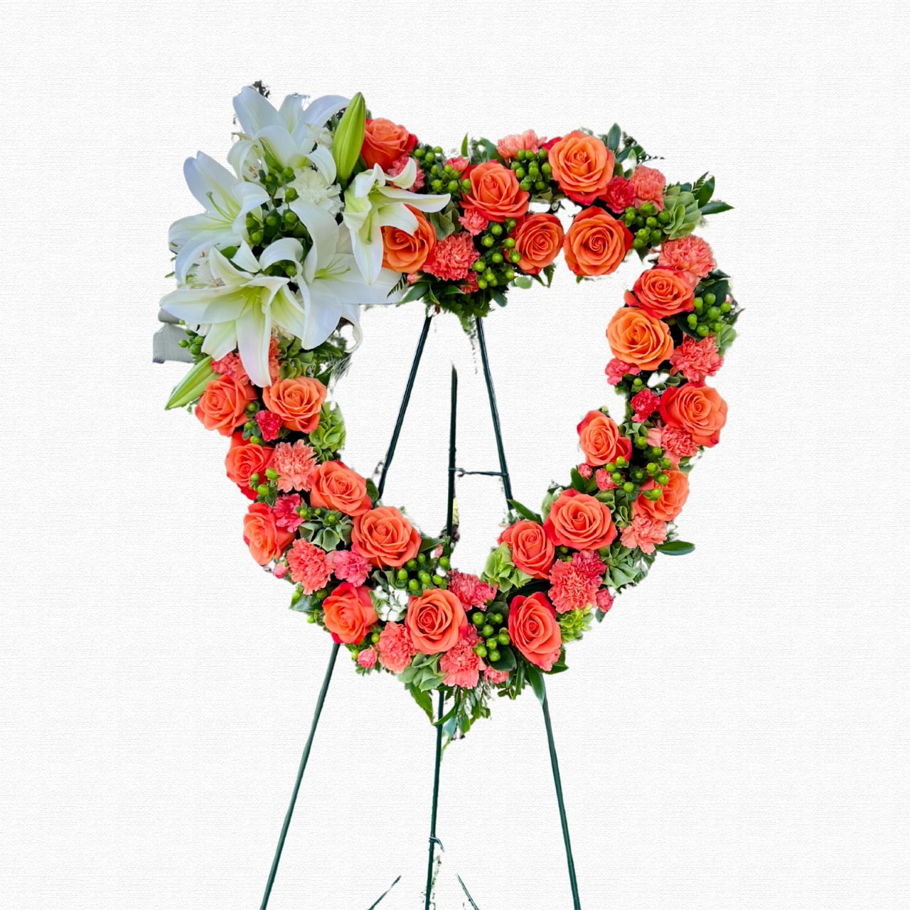Orange multicolor heart-shaped funeral tribute by Historic Dade City Florist