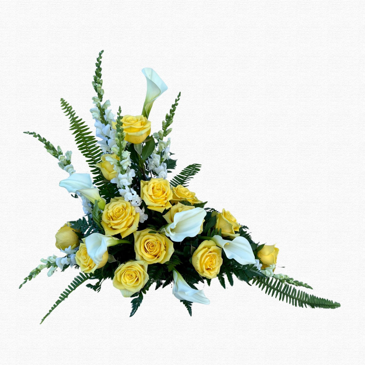 White and yellow elevated sympathy arrangement by Historic Dade City Florist