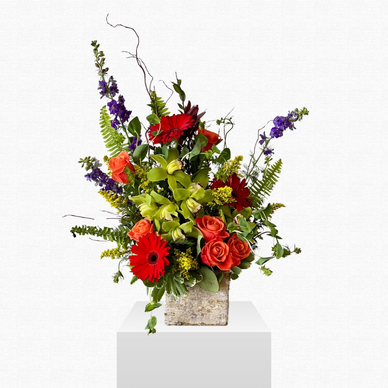 Purple and yellow tropical flower arrangement by Historic Dade City Florist