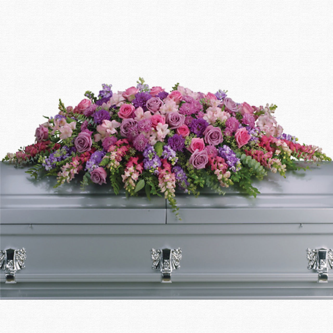 Purple and pink pastel casket spray by Historic Dade City Florist