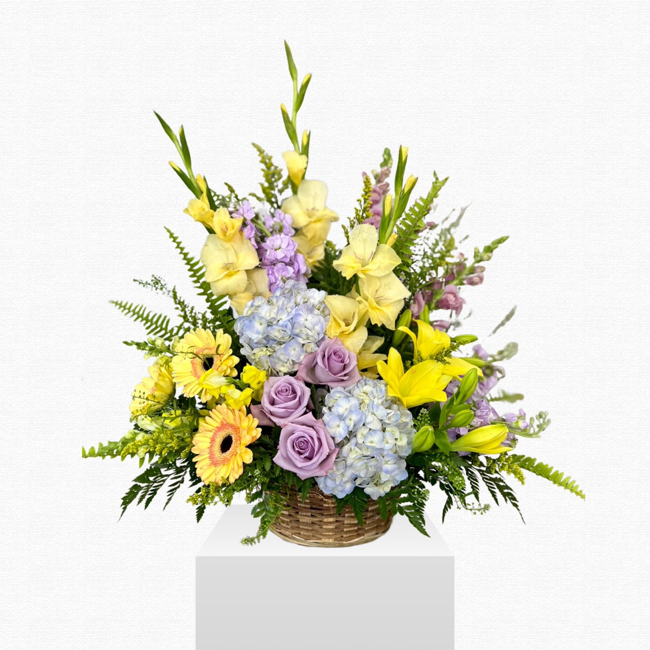 Purple and yellow floral funeral basket by Historic Dade City Florist
