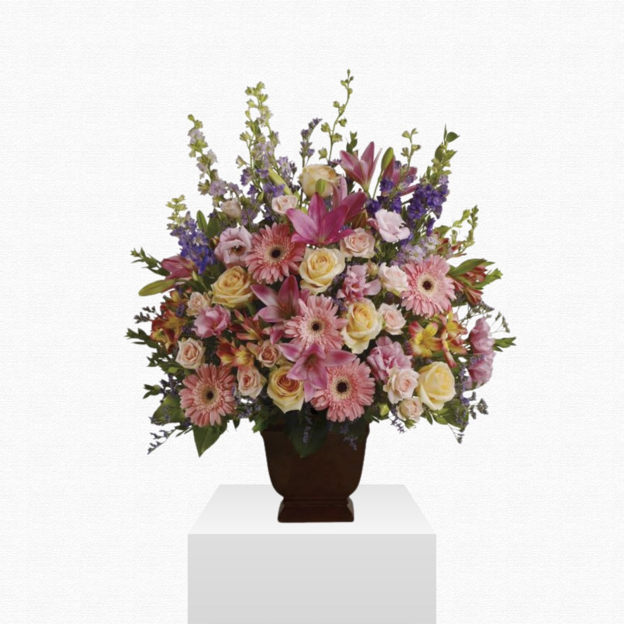 Pink and purple floral sympathy basket by Historic Dade City Florist