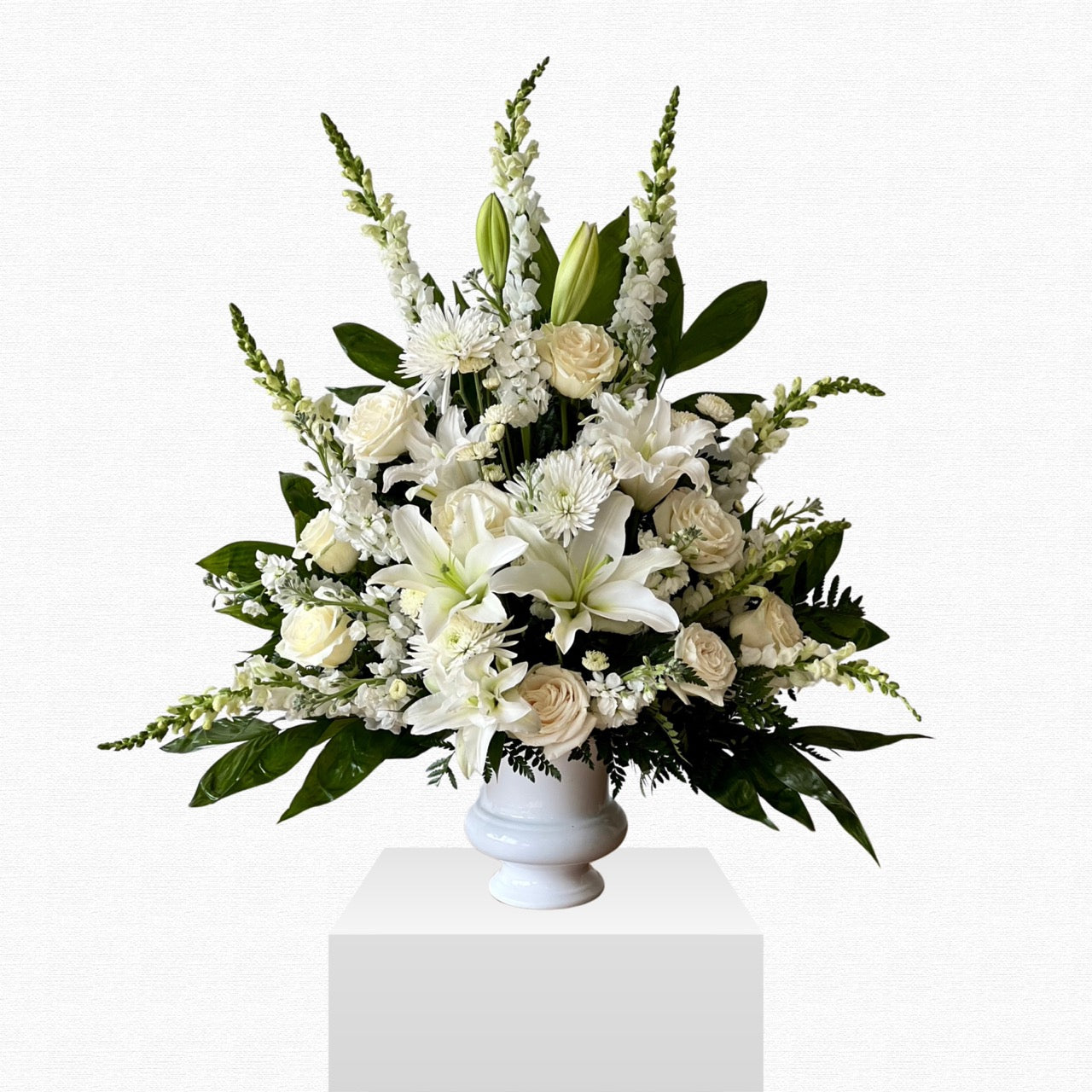 Pure white funeral sympathy basket by Historic Dade City Florist