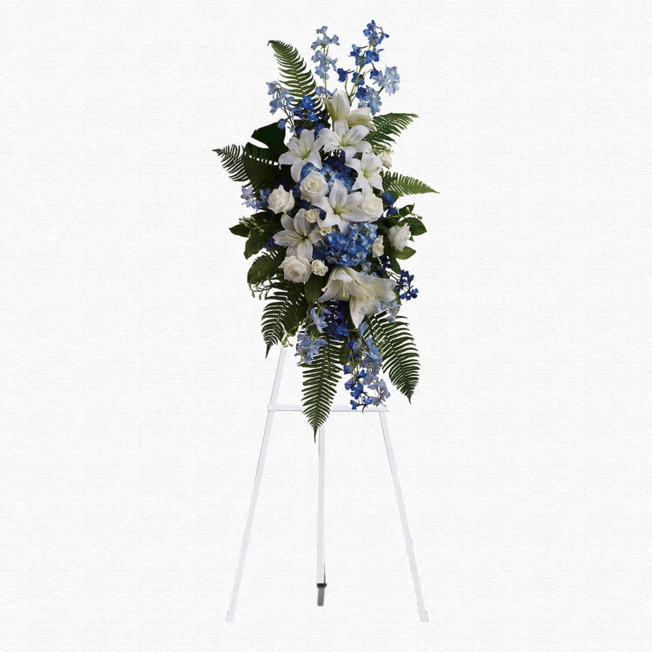 Blue and white tropical funeral spray by Historic Dade City Florist