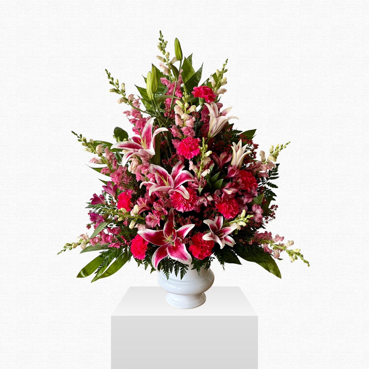 Pink floral sympathy basket arrangement by Historic Dade City Florist