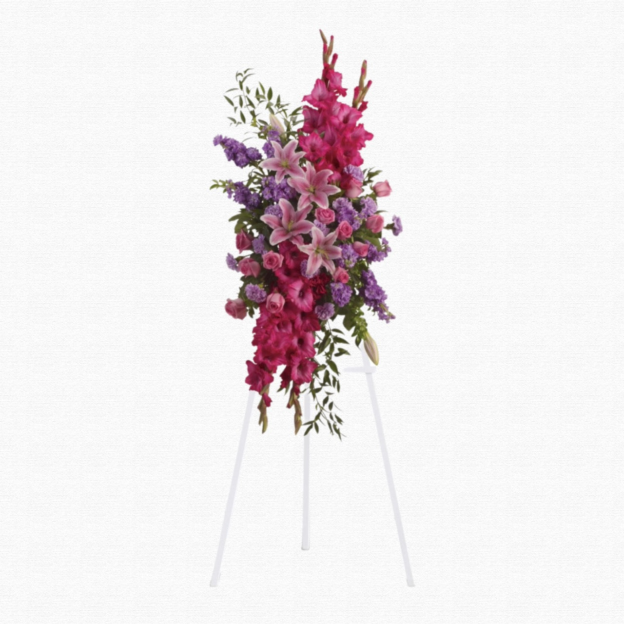 Pink and purple standing funeral spray by Historic Dade City Florist