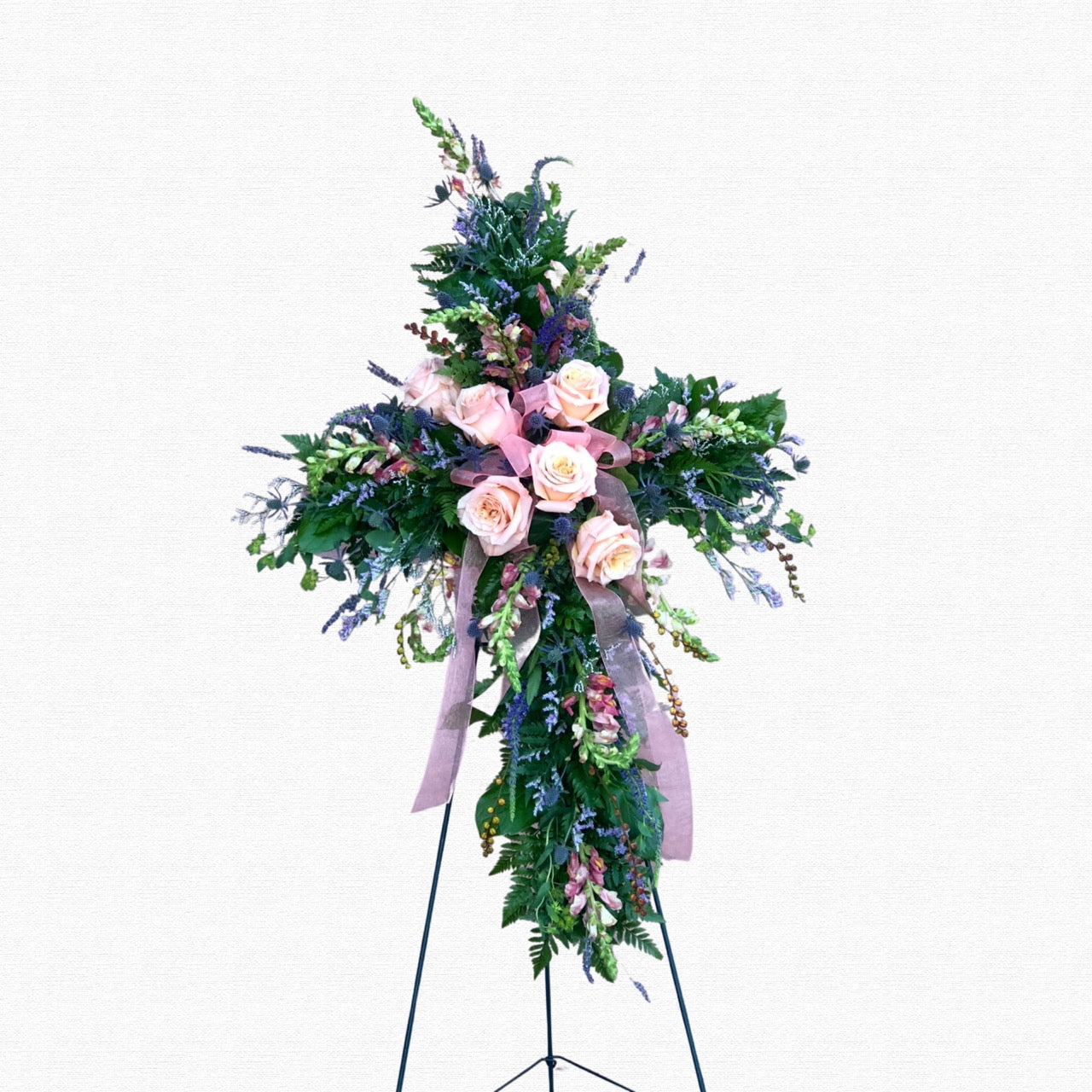Pink and blue floral funeral cross tribute by Historic Dade City Florist