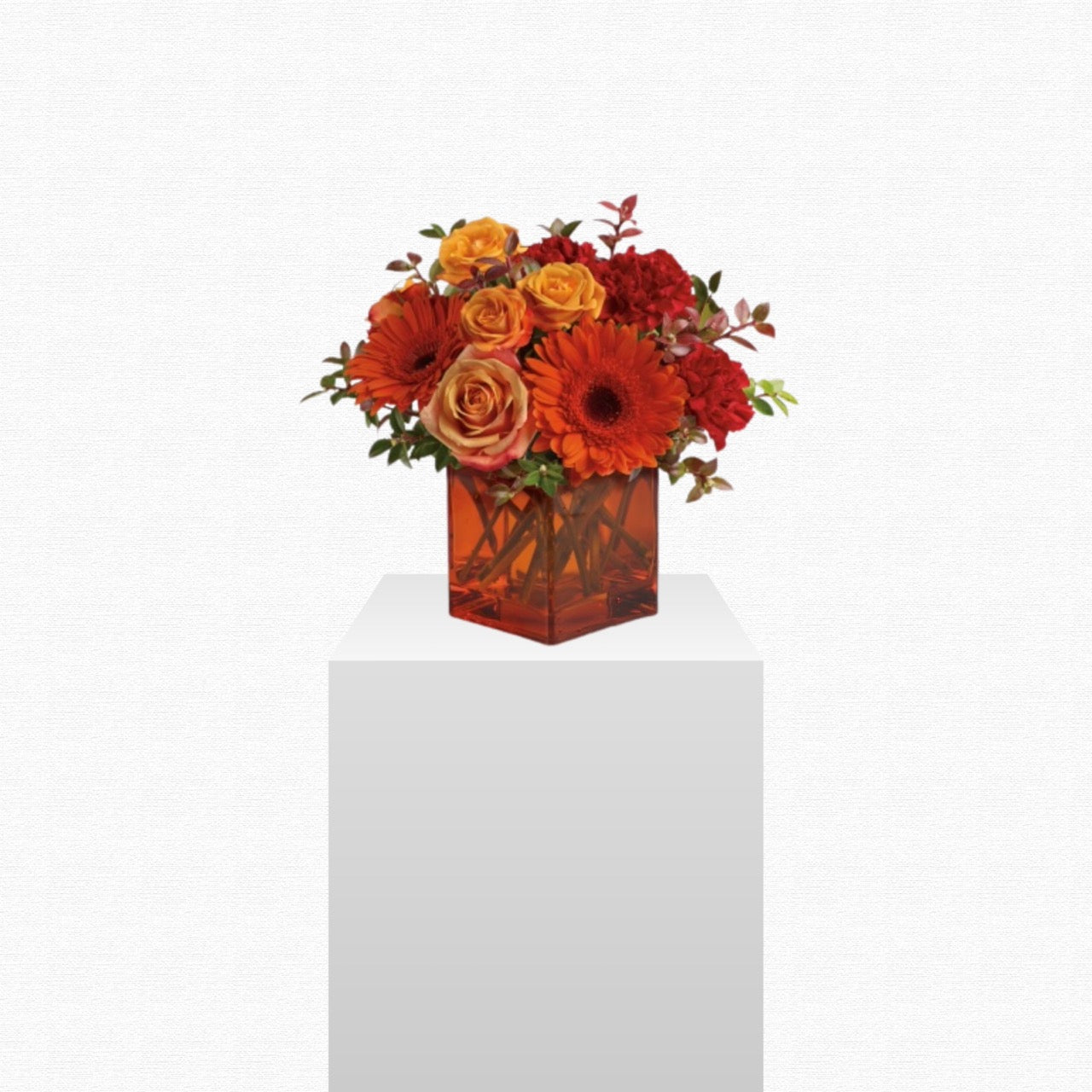 Yellow and orange sunrise-inspired flower arrangement by Historic Dade City Florist