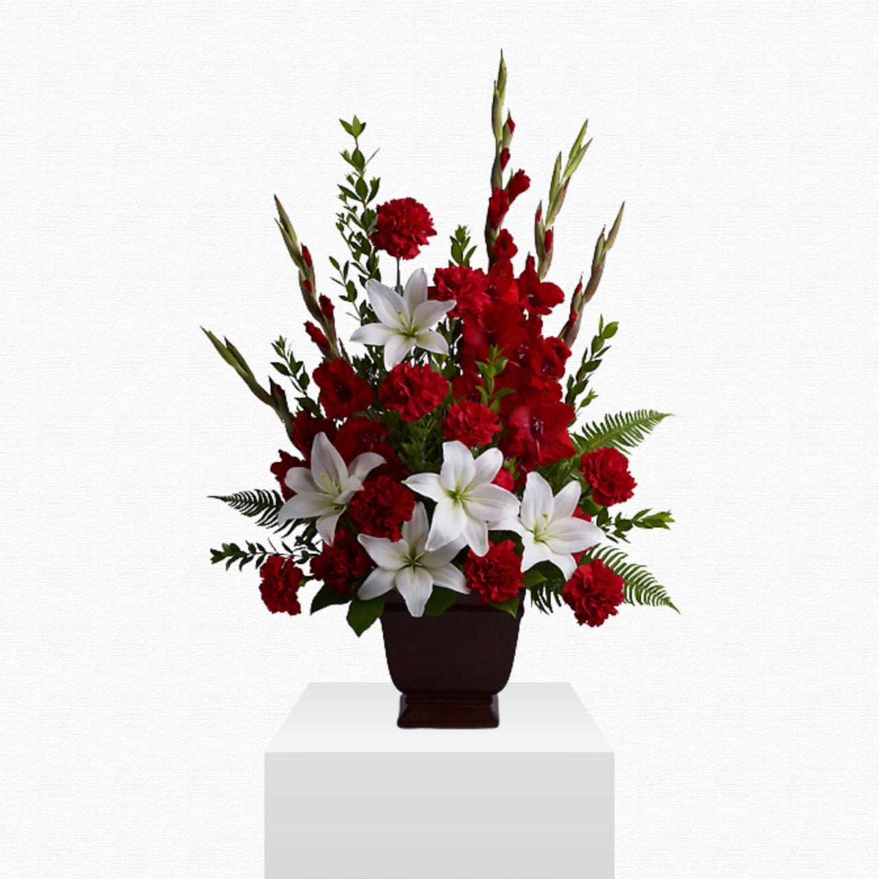 Red and white patriotic funeral basket by Historic Dade City Florist