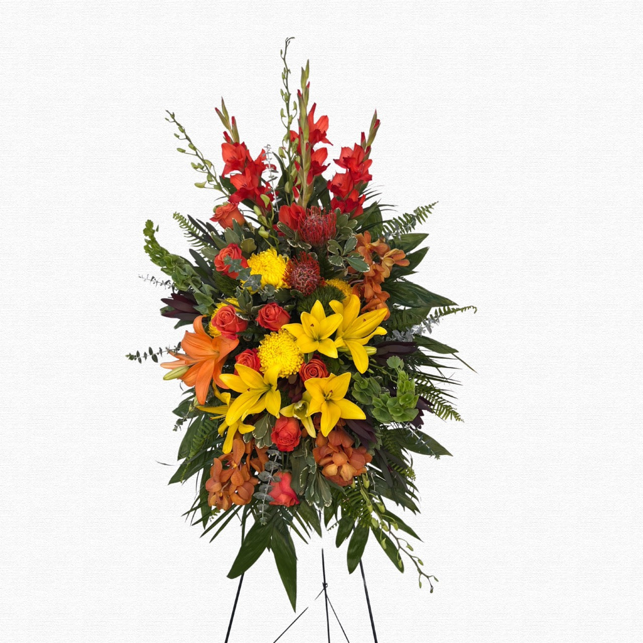 Colorful tropical standing funeral spray by Historic Dade City Florist