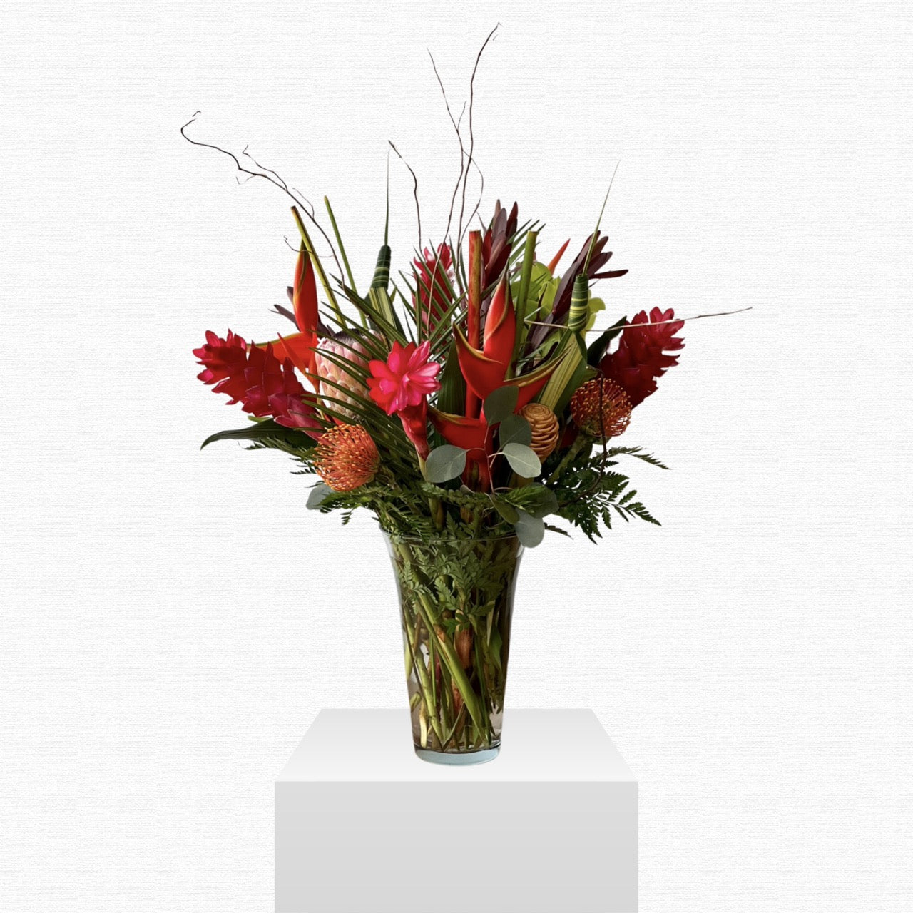 Tropical orange and pink flower arrangement by Historic Dade City Florist