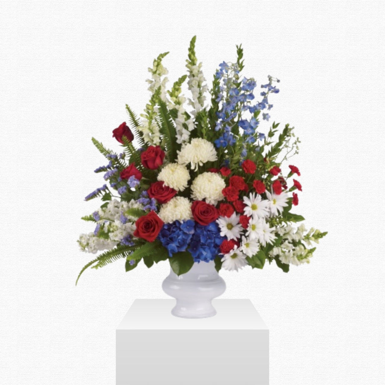 Patriotic red, white, and blue funeral basket by Historic Dade City Florist