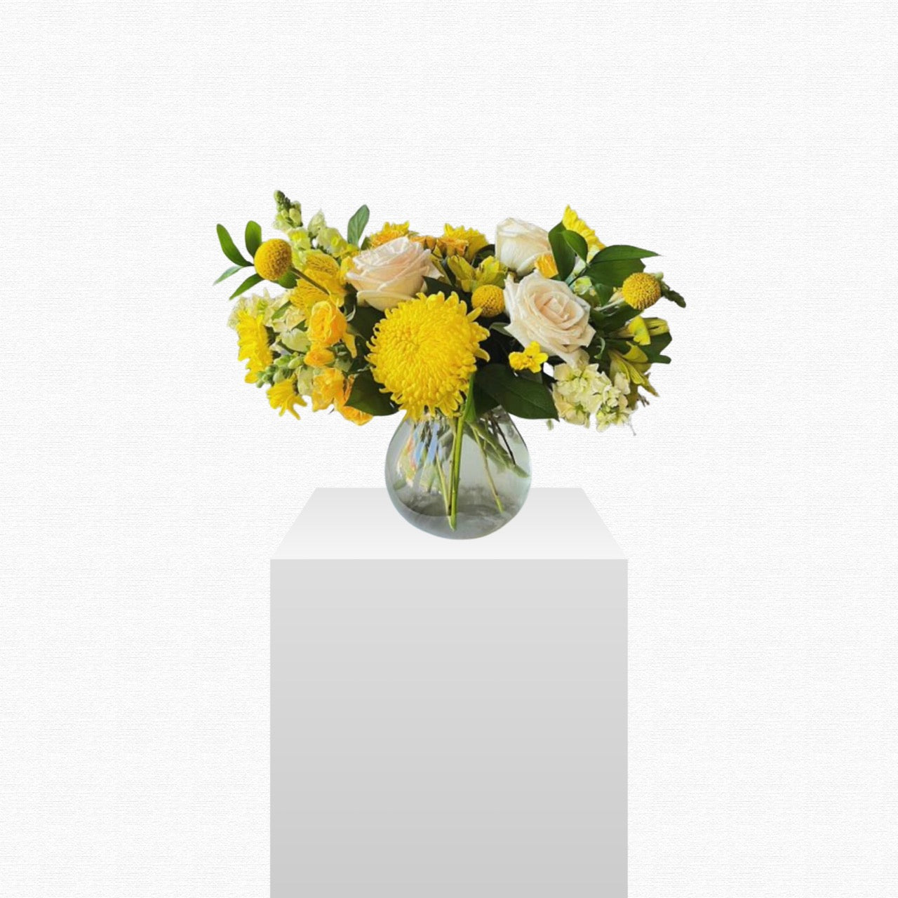 Yellow and white cheerful flower arrangement by Historic Dade City Florist